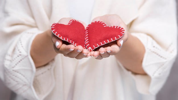 close-up-woman-holding-hearts_23-2148306458.jpg