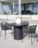 Taimi round outdoor table made of concrete with black finish Ø 110 cm