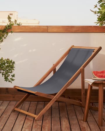 Adredna folding outdoor deck chair in black with solid acacia wood
