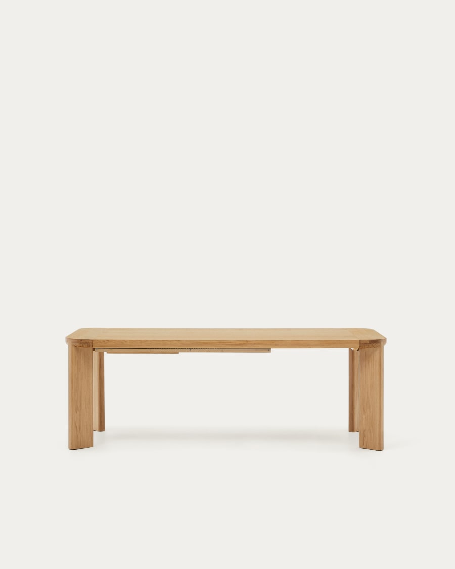 Oqui extendable oval table with an oak veneer and solid wood legs Ø 140  (220) x 90 cm